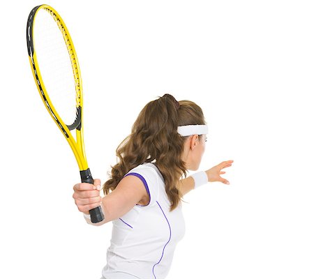 Tennis player ready to hit ball. rear view Stock Photo - Budget Royalty-Free & Subscription, Code: 400-06640987