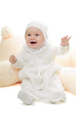 Playful baby girl in bound dress. High key Stock Photo - Budget Royalty-Free & Subscription, Code: 400-06641049