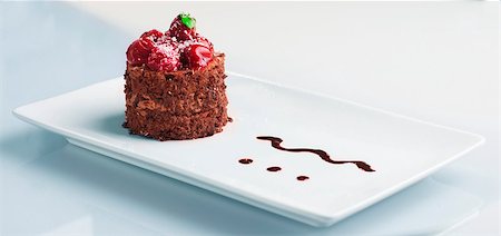 Dessert on white pate with chocolate and cherry. Stock Photo - Budget Royalty-Free & Subscription, Code: 400-06641976