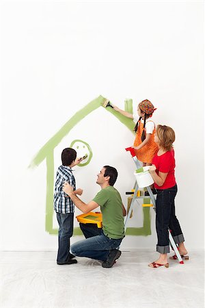 Happy family painting their home together with the kids Stock Photo - Budget Royalty-Free & Subscription, Code: 400-06642090