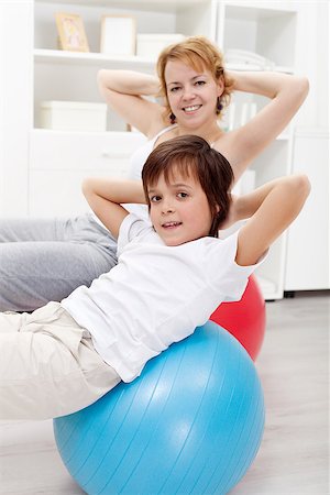 Healthy life - people exercising at home Fotografie stock - Microstock e Abbonamento, Codice: 400-06642106