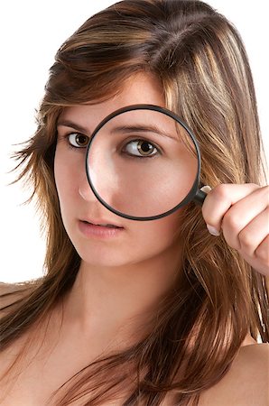 simsearch:400-04554899,k - Woman looking trough a magnifying glass, isolated in a white background Stock Photo - Budget Royalty-Free & Subscription, Code: 400-06642219