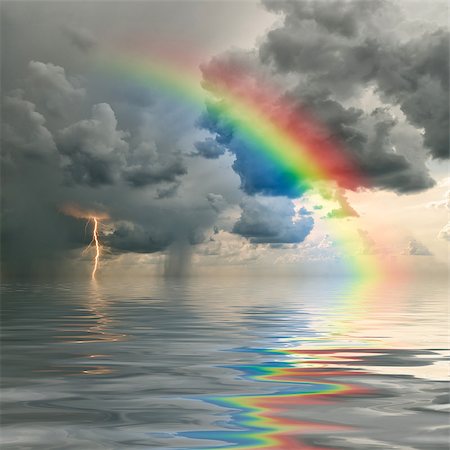rain storm clouds lightening - Colorful rainbow over ocean, thunderstorm with rain and lightning on background Stock Photo - Budget Royalty-Free & Subscription, Code: 400-06642557