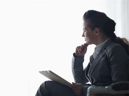 simsearch:400-04287211,k - Silhouette of thoughtful business woman with tablet pc Stock Photo - Budget Royalty-Free & Subscription, Code: 400-06642769