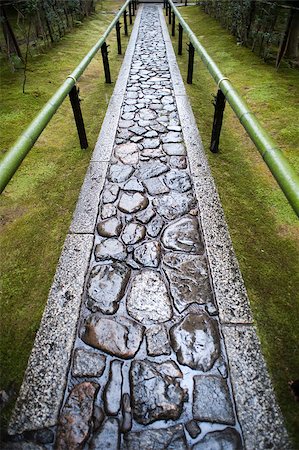 Wet paved footpath between bamboo railings in the formal garden at Koto-in, a sub temple of Daitoku-ji in Nara , Japan Stock Photo - Budget Royalty-Free & Subscription, Code: 400-06643231