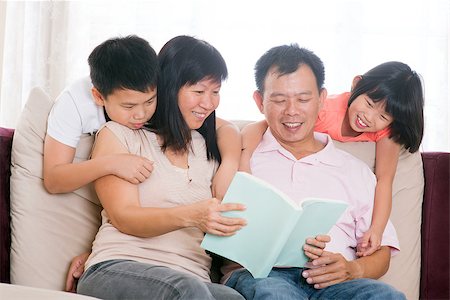 Southeast Asian family living lifestyle. Parents and children reading books at home. Stock Photo - Budget Royalty-Free & Subscription, Code: 400-06643526