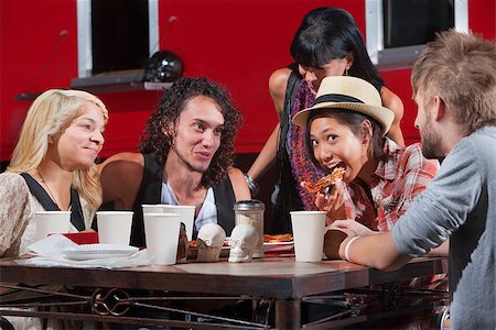 eating at food truck - Friends playing with pizza outside at table Stock Photo - Budget Royalty-Free & Subscription, Code: 400-06643787