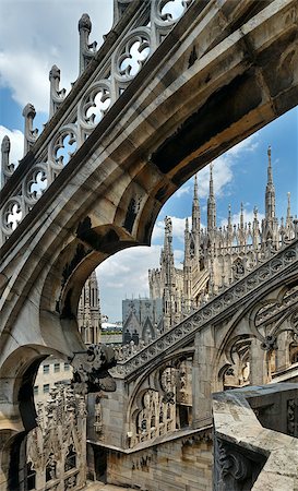 duomo milano - The roof of Milan Cathedral (or Duomo di Milano). Construction began in 1386, but it ended only in 1813. Stock Photo - Budget Royalty-Free & Subscription, Code: 400-06643810