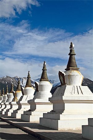 White pagodas Tibet with mountain and blue sky Stock Photo - Budget Royalty-Free & Subscription, Code: 400-06643950