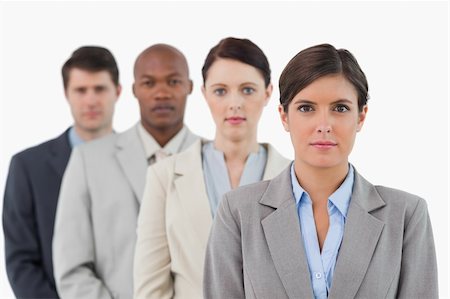 simsearch:6109-06002735,k - Serious looking salesteam standing together against a white background Stock Photo - Budget Royalty-Free & Subscription, Code: 400-06685460