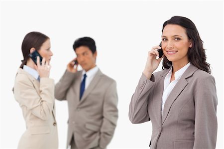 simsearch:400-06686562,k - Salespeople on the phone against a white background Foto de stock - Super Valor sin royalties y Suscripción, Código: 400-06685529