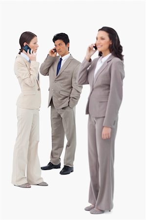 simsearch:400-06686555,k - Salespeople on their cellphones against a white background Stock Photo - Budget Royalty-Free & Subscription, Code: 400-06685533