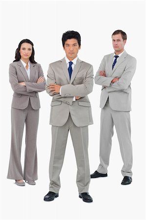 simsearch:400-07186359,k - Young businessteam with folded arms against a white background Stock Photo - Budget Royalty-Free & Subscription, Code: 400-06685585