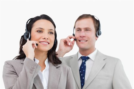 simsearch:400-06108986,k - Telephone help desk employees with headsets against a white background Stock Photo - Budget Royalty-Free & Subscription, Code: 400-06685580