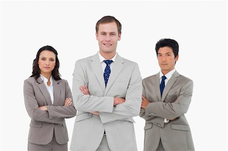 simsearch:400-07186359,k - Confident young businessteam with arms folded against a white background Stock Photo - Budget Royalty-Free & Subscription, Code: 400-06685582