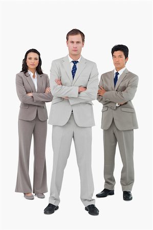 simsearch:400-07186359,k - Serious young businessteam standing together against a white background Stock Photo - Budget Royalty-Free & Subscription, Code: 400-06685583