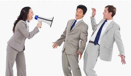 simsearch:400-06763387,k - Businesswoman with megaphone shouting at colleagues against a white background Stock Photo - Budget Royalty-Free & Subscription, Code: 400-06685596