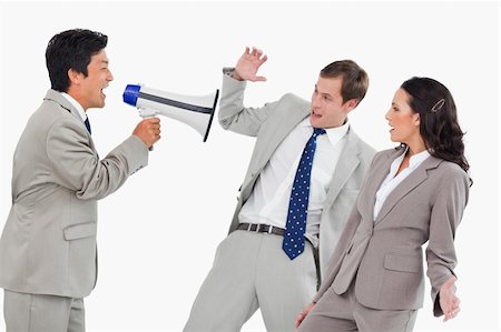 simsearch:400-06763387,k - Businessman with megaphone yelling at colleagues against a white background Stock Photo - Budget Royalty-Free & Subscription, Code: 400-06685598