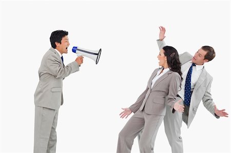 simsearch:400-06763387,k - Salesman with megaphone yelling at colleagues against a white background Stock Photo - Budget Royalty-Free & Subscription, Code: 400-06685599