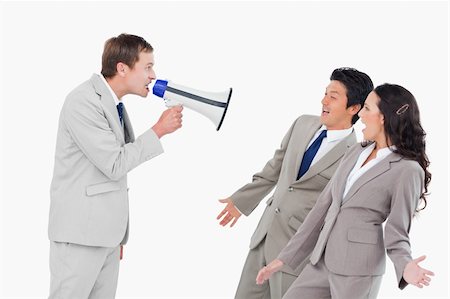simsearch:400-06763387,k - Salesman with megaphone shouting at associates against a white background Stock Photo - Budget Royalty-Free & Subscription, Code: 400-06685603