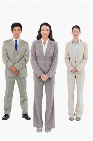 simsearch:6109-06002735,k - Businesswoman with her team behind her against a white background Stock Photo - Budget Royalty-Free & Subscription, Code: 400-06685625