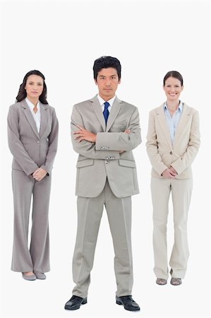 simsearch:6109-06002735,k - Confident businessman with his team behind him against a white background Stock Photo - Budget Royalty-Free & Subscription, Code: 400-06685623