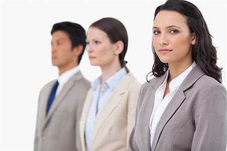 simsearch:6109-06002735,k - Businesswoman with colleagues next to her against a white background Stock Photo - Budget Royalty-Free & Subscription, Code: 400-06685654