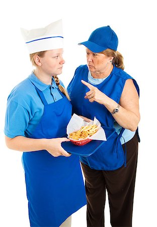 simsearch:400-06917337,k - Boss yells at teenage fast food worker.  Isolated on white background. Photographie de stock - Aubaine LD & Abonnement, Code: 400-06685879