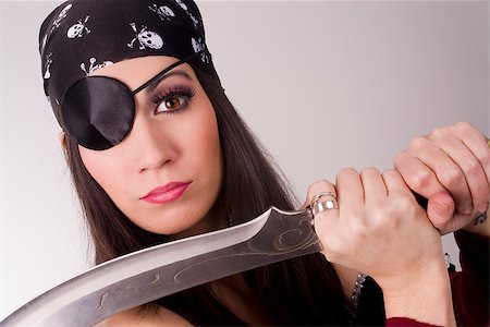 eye patch - A beautiful pirate shows you her blade Stock Photo - Budget Royalty-Free & Subscription, Code: 400-06686108