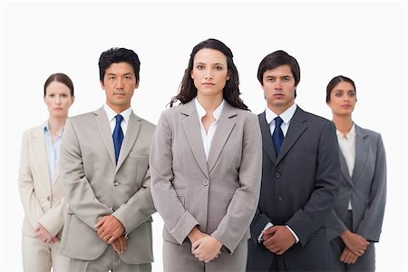 simsearch:6109-06002735,k - Tradeswoman standing with her colleagues against a white background Stock Photo - Budget Royalty-Free & Subscription, Code: 400-06686496