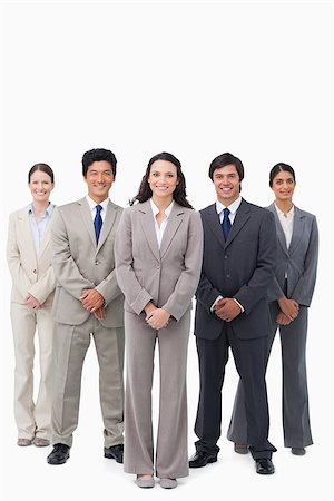simsearch:6109-06002735,k - Smiling tradeswoman standing with her team against a white background Stock Photo - Budget Royalty-Free & Subscription, Code: 400-06686499