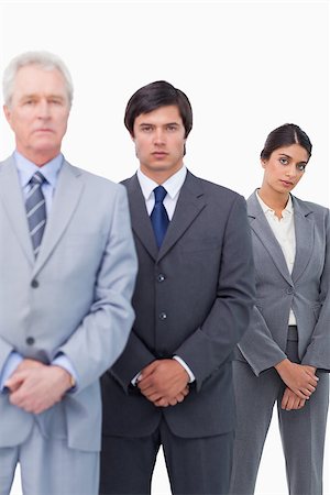 simsearch:6109-06002735,k - Mature businessman standing with his employees against a white background Stock Photo - Budget Royalty-Free & Subscription, Code: 400-06686530