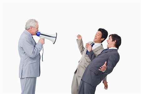 simsearch:400-06763387,k - Senior businessman with megaphone yelling at his employees against a white background Stock Photo - Budget Royalty-Free & Subscription, Code: 400-06686542