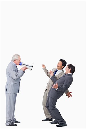 simsearch:400-06763387,k - Mature businessman with megaphone yelling at his employees against a white background Stock Photo - Budget Royalty-Free & Subscription, Code: 400-06686543