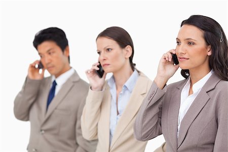 simsearch:400-06393704,k - Businesspeople on the phone against a white background Stock Photo - Budget Royalty-Free & Subscription, Code: 400-06686552