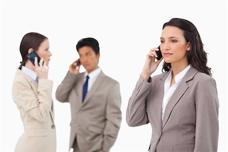 simsearch:400-06686562,k - Businesspeople talking on the phone against a white background Foto de stock - Super Valor sin royalties y Suscripción, Código: 400-06686553