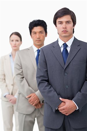 simsearch:6109-06002735,k - Young salesteam standing in line against a white background Stock Photo - Budget Royalty-Free & Subscription, Code: 400-06686576