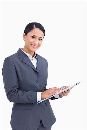 simsearch:400-06633122,k - Close up of saleswoman with pen and clipboard against a white background Stock Photo - Budget Royalty-Free & Subscription, Code: 400-06686621