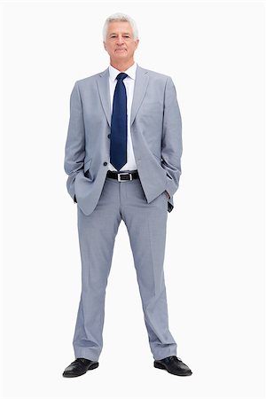 Portrait of a businessman with his hands in his pockets against white background Stock Photo - Budget Royalty-Free & Subscription, Code: 400-06687066