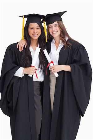 Two smiling women graduate from university as they embrace one another Stock Photo - Budget Royalty-Free & Subscription, Code: 400-06687330