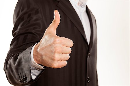 simsearch:400-05946445,k - close up of strong male hand of businessman showing thumbs up on white background Foto de stock - Super Valor sin royalties y Suscripción, Código: 400-06687574