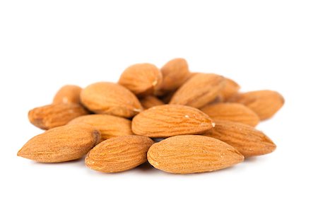 simsearch:400-07210943,k - Closeup view of almonds over white background Stock Photo - Budget Royalty-Free & Subscription, Code: 400-06687686