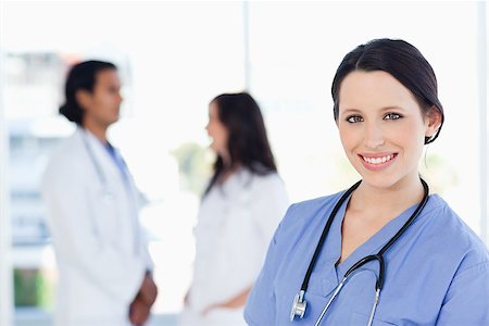 Young and confident medical intern looking at the camera with a great smile Stock Photo - Budget Royalty-Free & Subscription, Code: 400-06688520