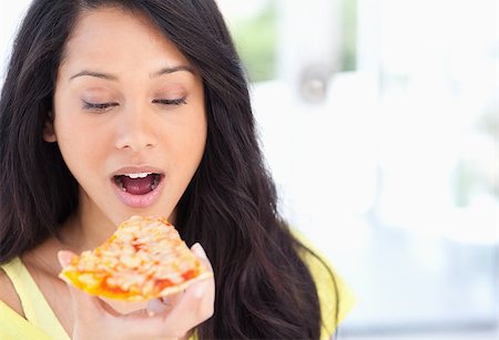 eat mouth closeup - A woman about to eat a slice of pizza that she is looking at Stock Photo - Budget Royalty-Free & Subscription, Code: 400-06688552