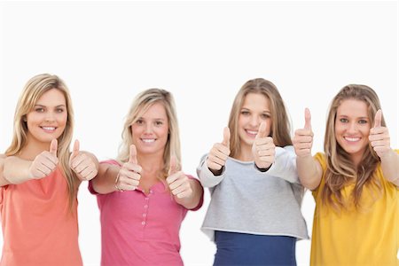 simsearch:400-06634629,k - A group of girls looking at the camera while smiling and giving a thumbs up Fotografie stock - Microstock e Abbonamento, Codice: 400-06688916