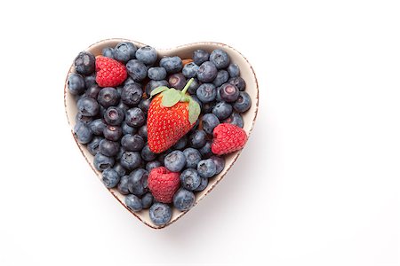 strawberry heart - Different berries in  a heart shaped bowl against a white background Stock Photo - Budget Royalty-Free & Subscription, Code: 400-06689128