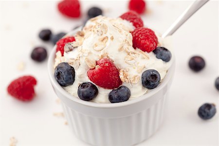 simsearch:400-08110674,k - Sweet berries in whipped cream against white background Stockbilder - Microstock & Abonnement, Bildnummer: 400-06689156