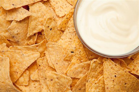 simsearch:400-06689258,k - Nachos surrounding a bowl of white dip in the corner Stock Photo - Budget Royalty-Free & Subscription, Code: 400-06689236