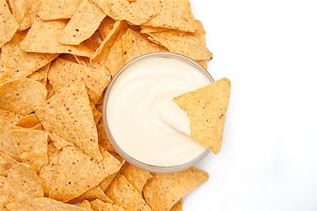 simsearch:400-06689258,k - Bowl of white dip surrounded by chips Stock Photo - Budget Royalty-Free & Subscription, Code: 400-06689239