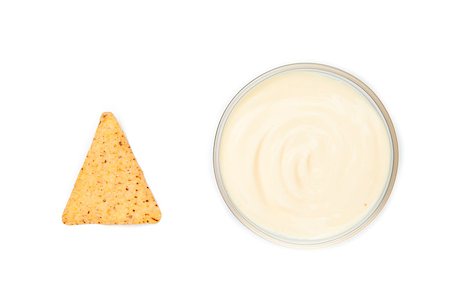 simsearch:400-06689258,k - A bowl of white dip and a nacho placed side by side Stock Photo - Budget Royalty-Free & Subscription, Code: 400-06689241